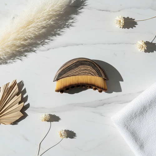 ContourFlow™ Lymphatic Facial Brush - flat lay on white marble with botanicals